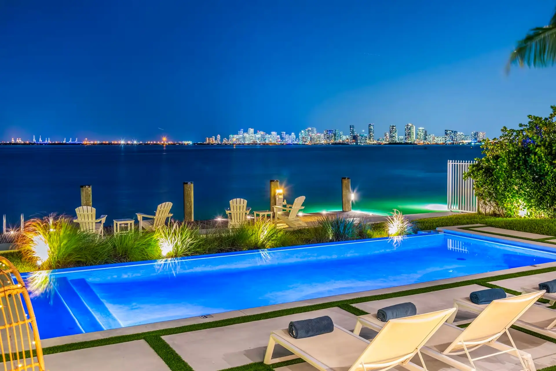 The pool and Miami skyline at night